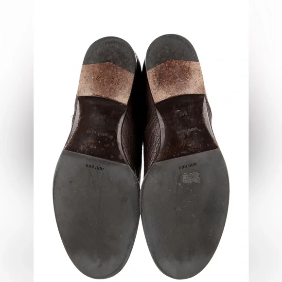 Miu Miu leather printed riding boots